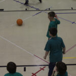 Kids playing octoball indoors with Octopit.