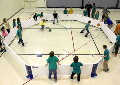 Overhead view of kids playing indoor octoball.